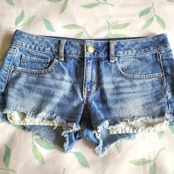 American Eagle High Waist Cut-Off Denim Shorts with Silver Glitter Star Pockets - Picture 2 of 9
